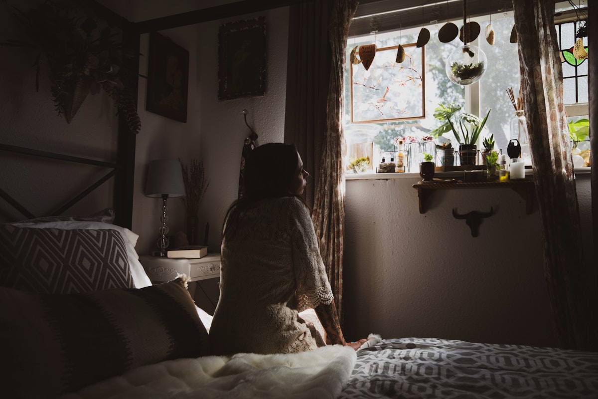 moody bedroom tones beside softer pastoral linens