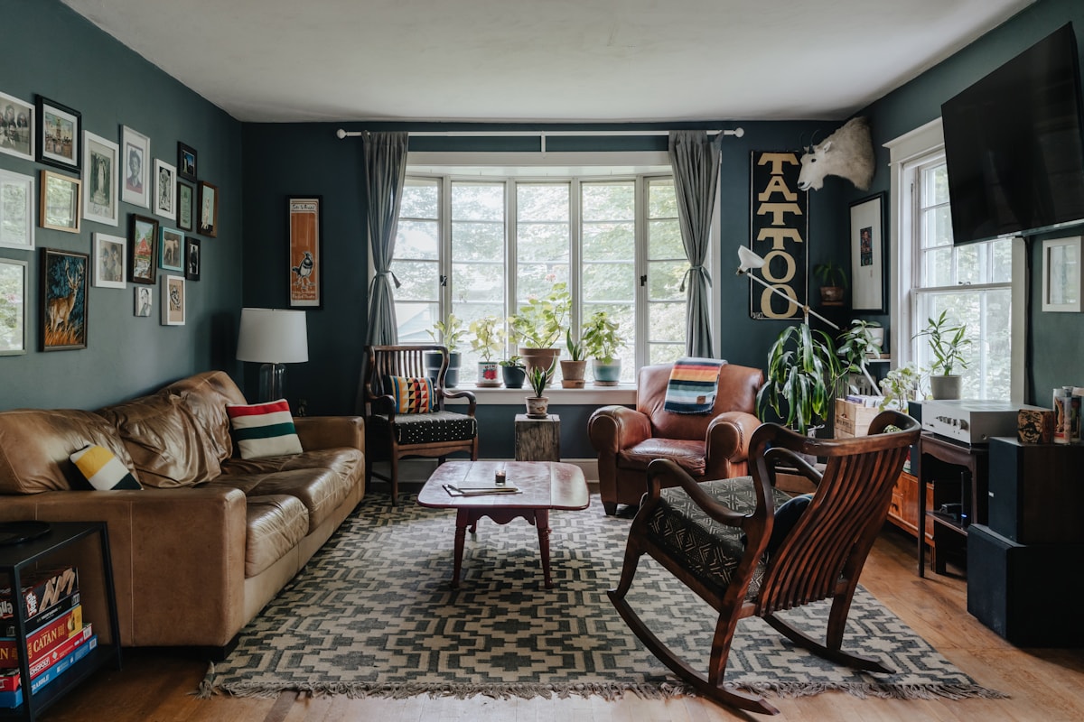 shadowy parlor with vintage textiles and aged wood